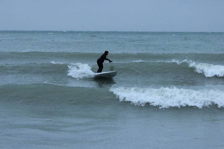 Robin Pacquing surfing.