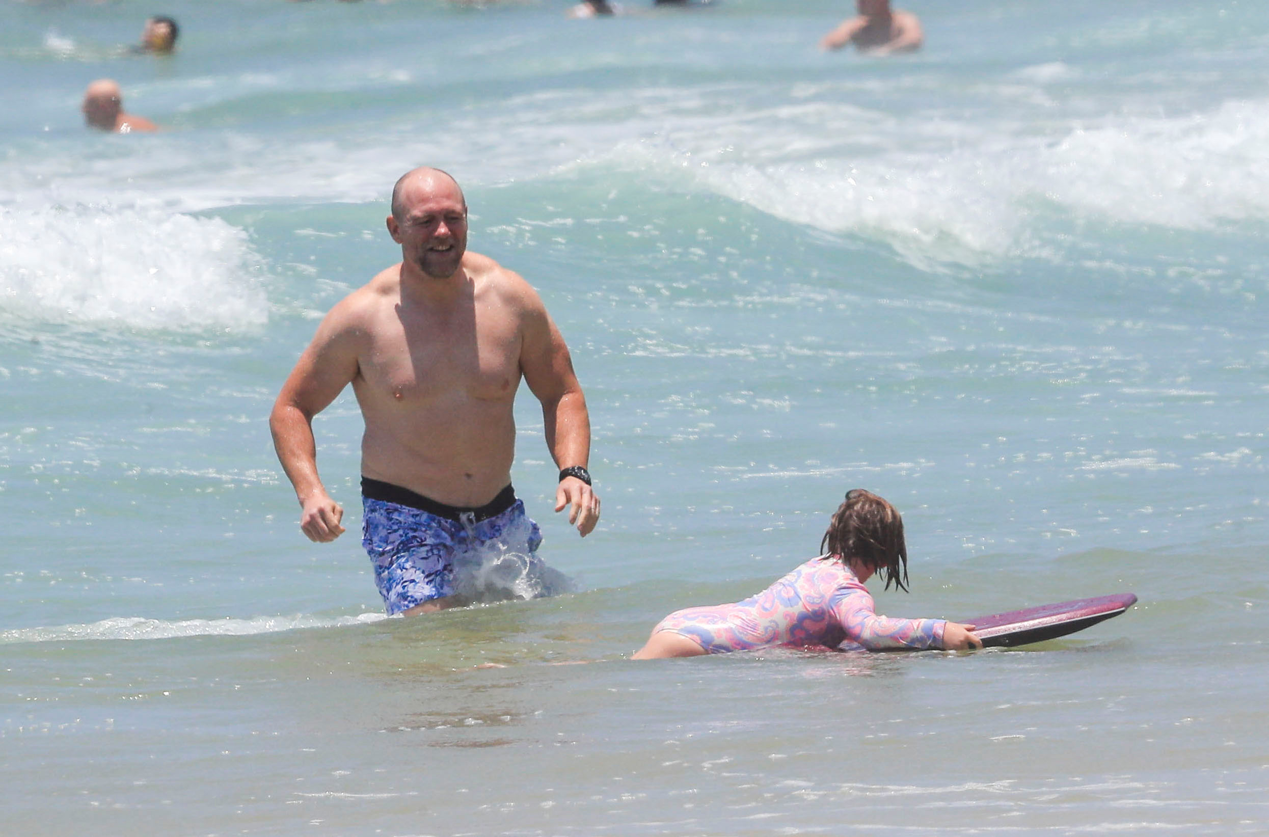 The ex-rugby star tried to teach daughter Mia how to catch some waves