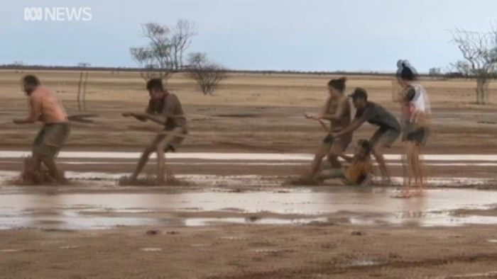 Kids playing in the rain across Queensland on Wednesday