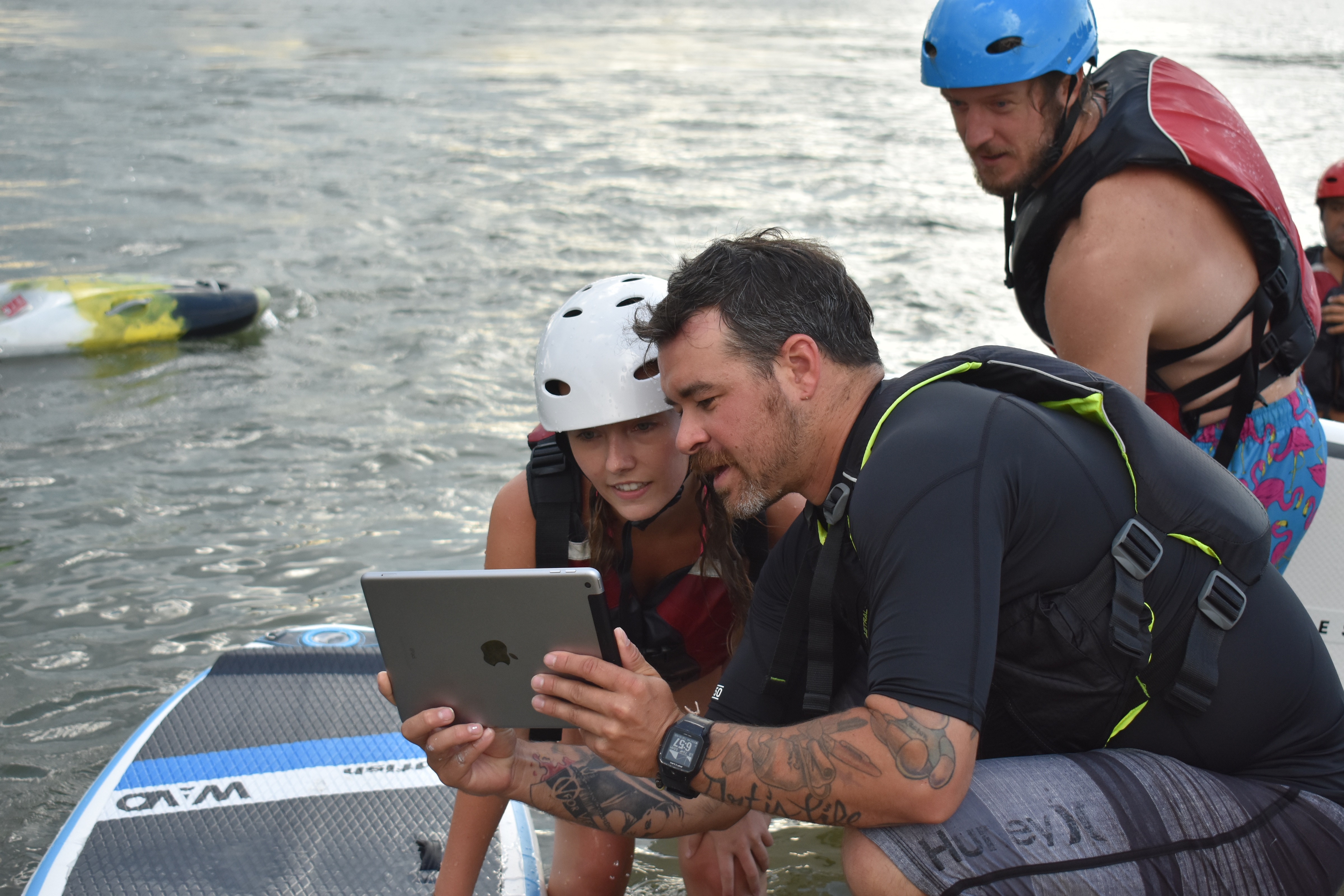 Students of Surf Dayton getting real time feedback from Thomas. Photo - Jake Brown