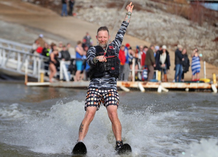<strong>David Yancey celebrates after successfully launching from the dock during the 43rd annual Ski Freeze at the Mud Island River Park on Jan. 1, 2020. Hosted by the Collierville Ski Club, water skiers, barefooters and wakeboarders braved the frigid water of the Wolf River to raise money for The Dream Factory of Memphis which grants wishes for critically and chronically ill children ages 3 through 18.</strong> (Jim Weber/Daily Memphian)