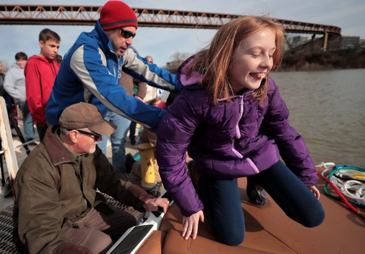 <strong>This year's beneficiary, 11-year-old Allie Gibson boards the ski boat for a close-up view of the skiiers during the 43rd annual Ski Freeze at the Mud Island River Park on Jan. 1, 2020. Hosted by the Collierville Ski Club, water skiers, barefooters and wakeboarders braved the frigid water of the Wolf River to raise money for The Dream Factory of Memphis which grants wishes for critically and chronically ill children ages 3 through 18.</strong> (Jim Weber/Daily Memphian)