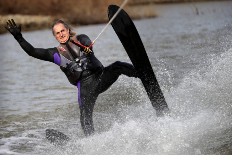 <strong>Denis Lackey tips a wave to the docks during the 43rd annual Ski Freeze at the Mud Island River Park on Jan. 1, 2020. Hosted by the Collierville Ski Club, water skiers, barefooters and wakeboarders braved the frigid water of the Wolf River to raise money for The Dream Factory of Memphis which grants wishes for critically and chronically ill children ages 3 through 18.</strong> (Jim Weber/Daily Memphian)