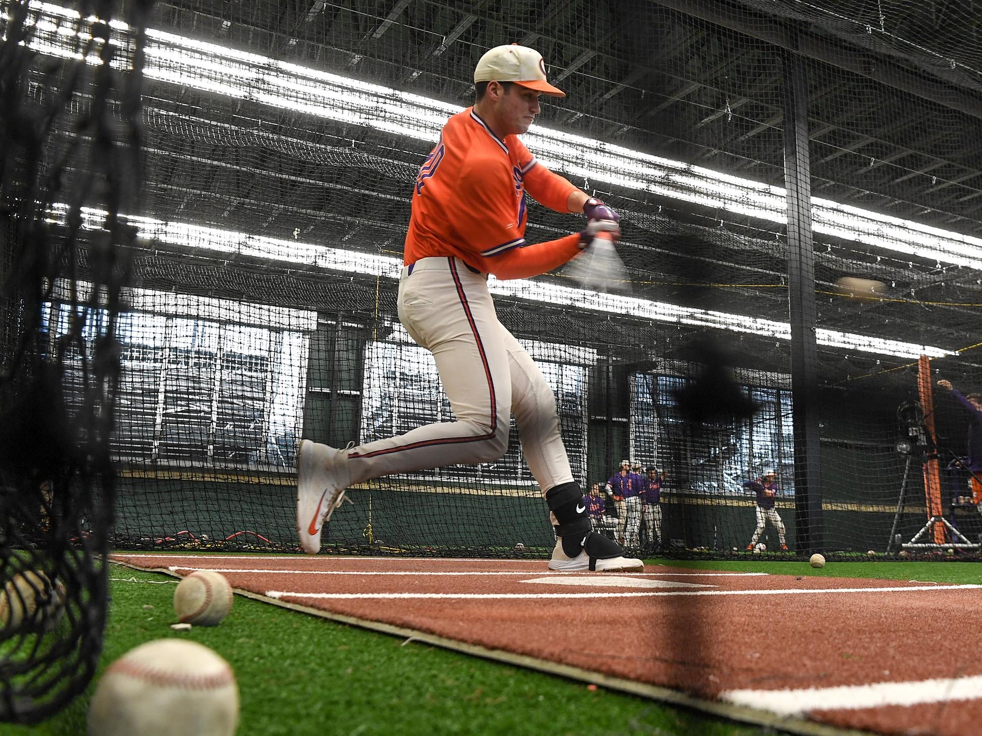 Clemson sophomore pitcher Davis Sharpe (30) swings in the batting cages during the first official team Spring practice at Doug Kingsmore Stadium in Clemson Friday, January 24, 2020.