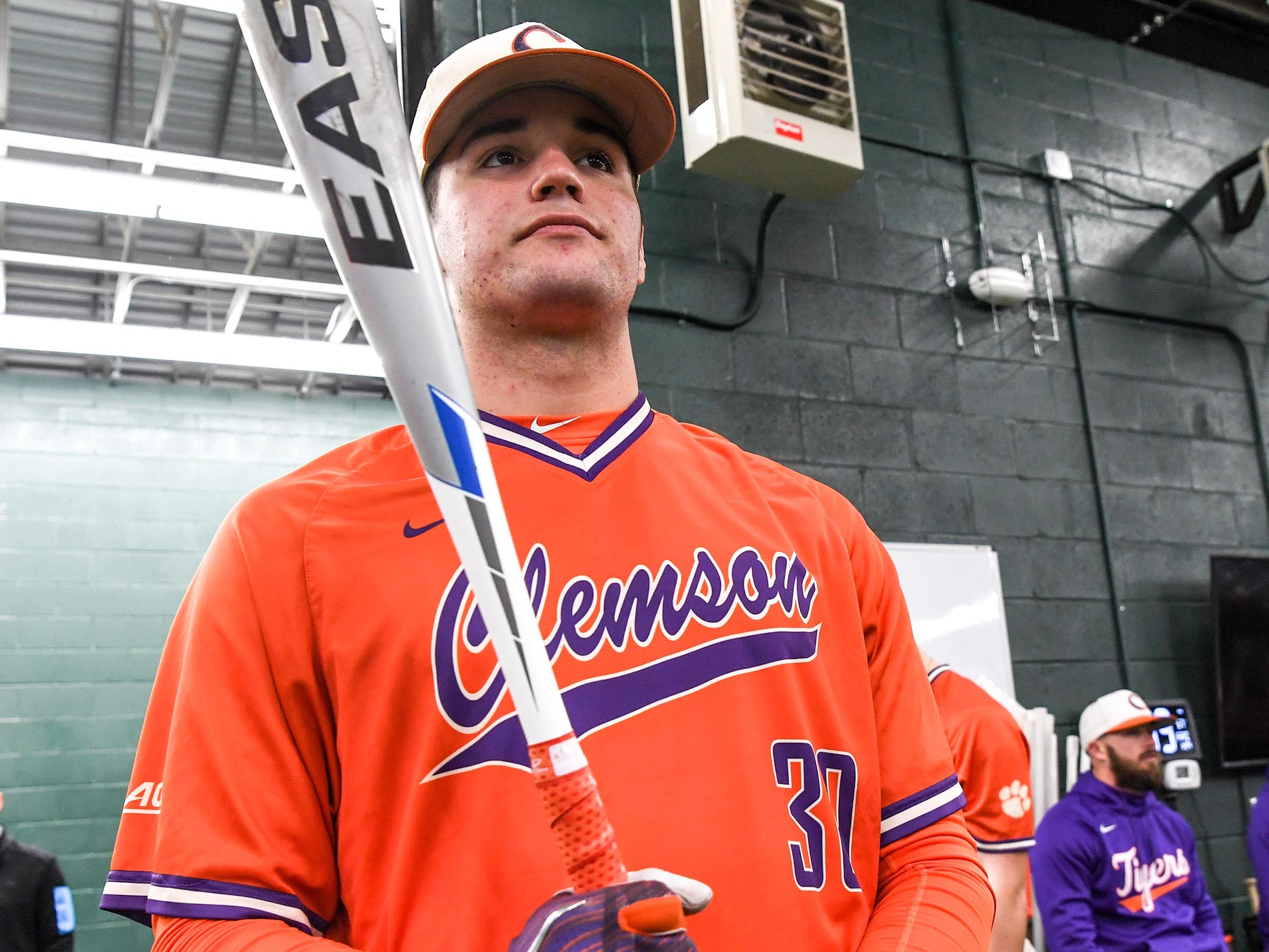 Clemson sophomore pitcher Davis Sharpe (30) swings in the batting cages during the first official team Spring practice at Doug Kingsmore Stadium in Clemson Friday, January 24, 2020.