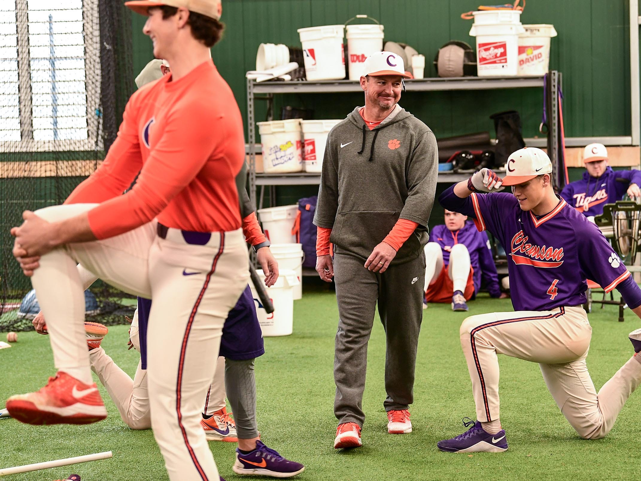 Clemson head coach Monte Lee walks around players during the first official team Spring practice at Doug Kingsmore Stadium in Clemson Friday, January 24, 2020.