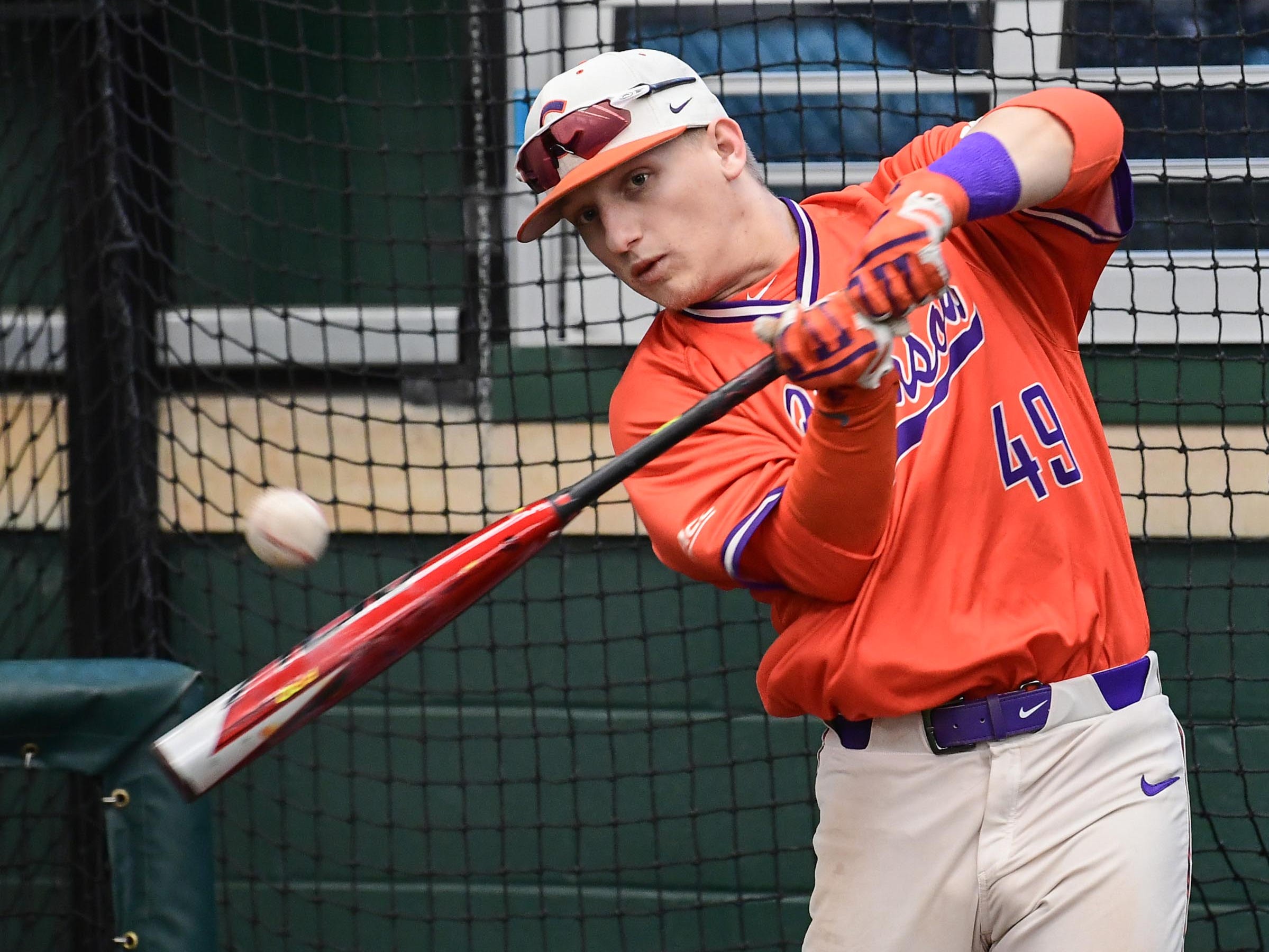 Clemson freshman Regan Reid(49), former T.L. Hanna High standout, swings during the first official team Spring practice at Doug Kingsmore Stadium in Clemson Friday, January 24, 2020.