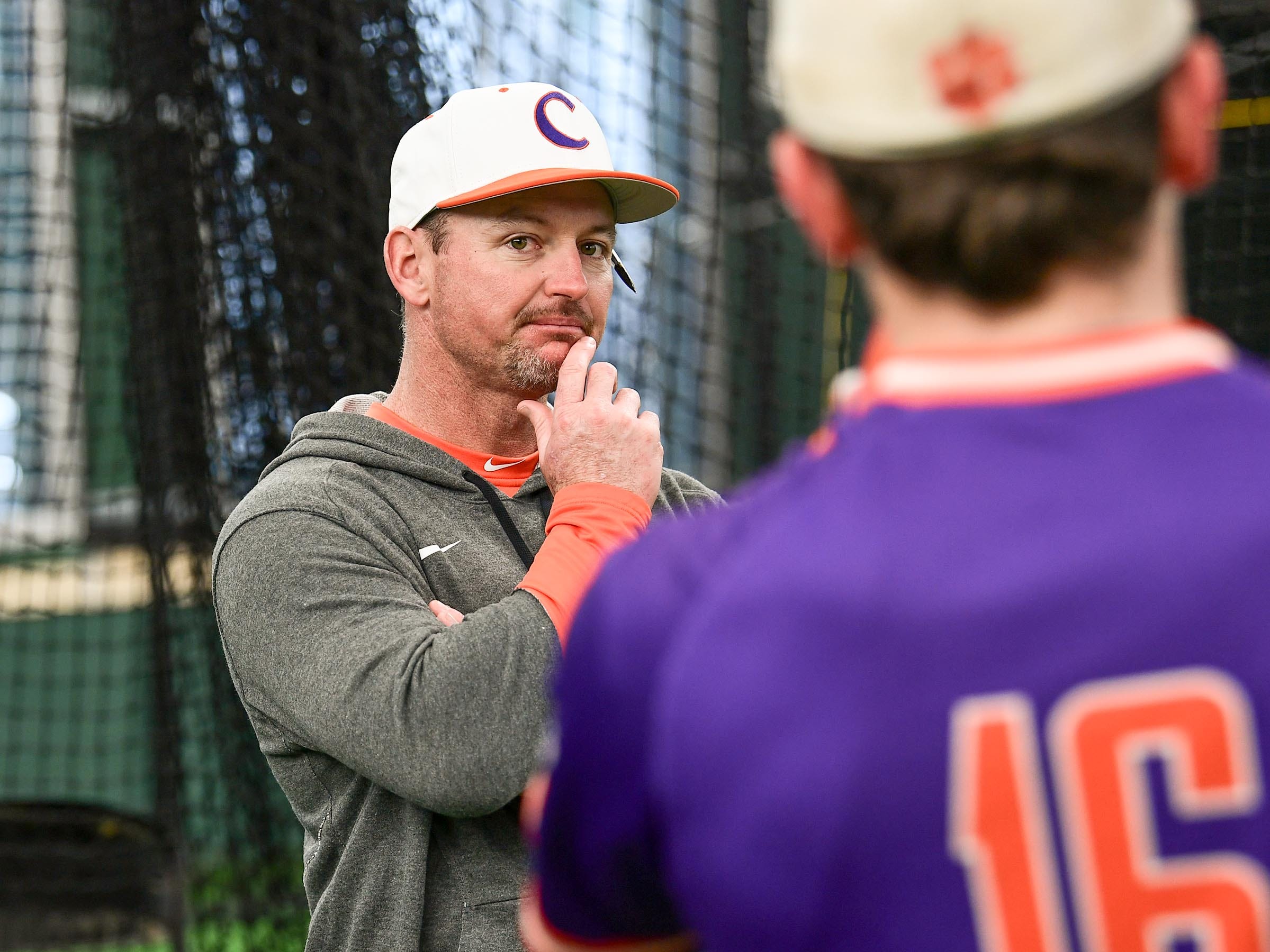 Clemson head coach Monte Lee talks with Clemson junior Bo Majkowski(16) during the first official team Spring practice at Doug Kingsmore Stadium in Clemson Friday, January 24, 2020.