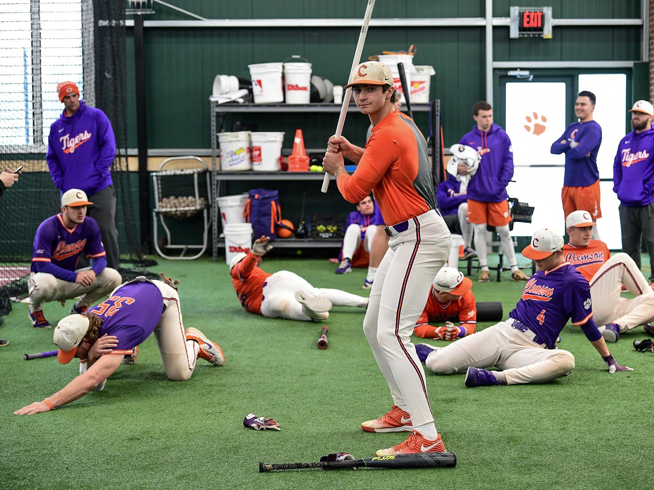 Clemson junior Bryce Teodosio (13), middle, uses a pvc pipe warming up during the first official team Spring practice at Doug Kingsmore Stadium in Clemson Friday, January 24, 2020.