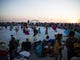 Seagulls fly over the community drum circle at Siesta Key Beach as the sun sets on the horizon on Sunday, January 21, 2018 in Sarasota. 