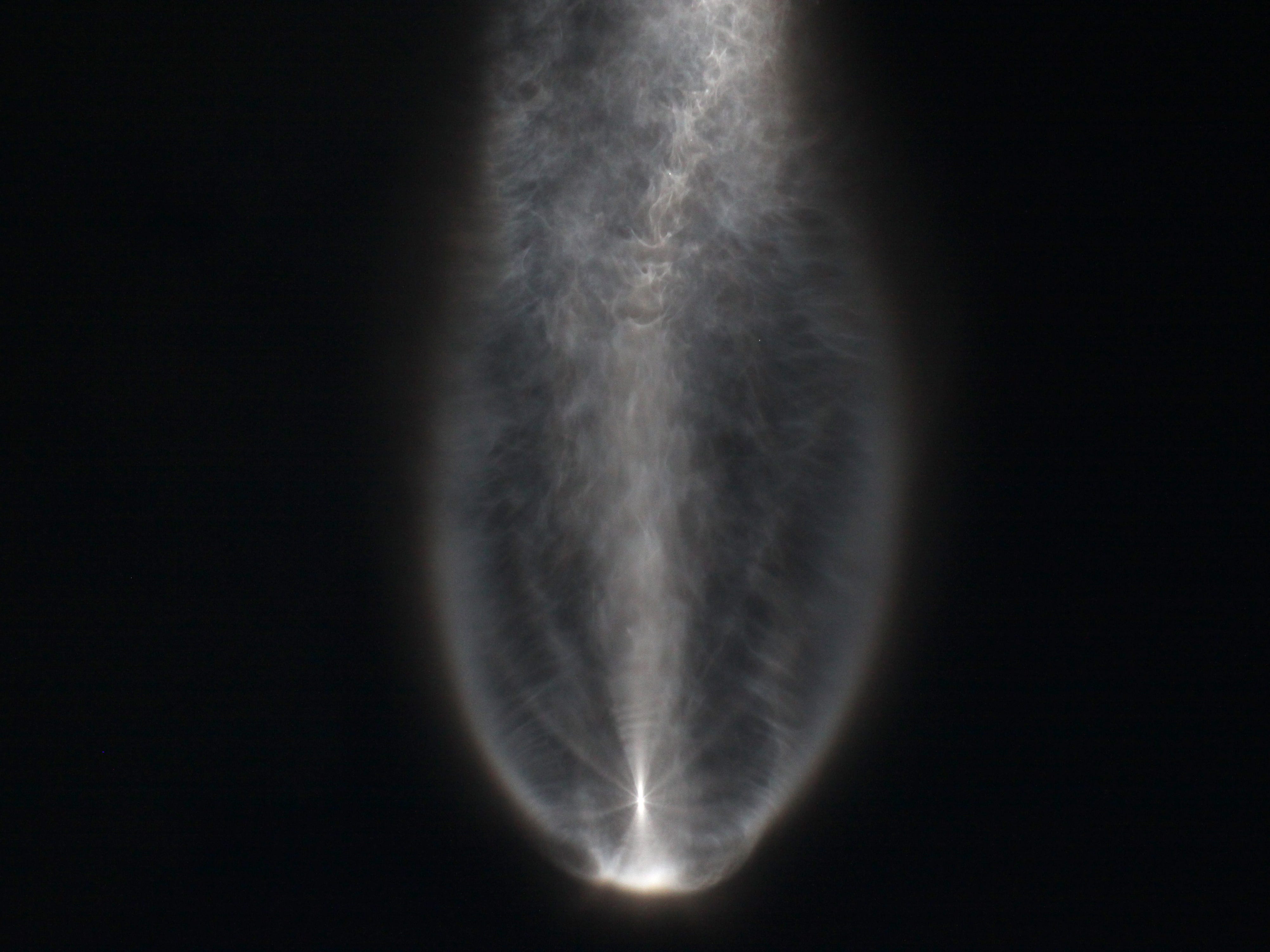 An atmospheric effect is generated by a United Launch Alliance Atlas V rocket as it takes a military communications satellite to orbit from Cape Canaveral on Thursday, Aug. 8, 2019.