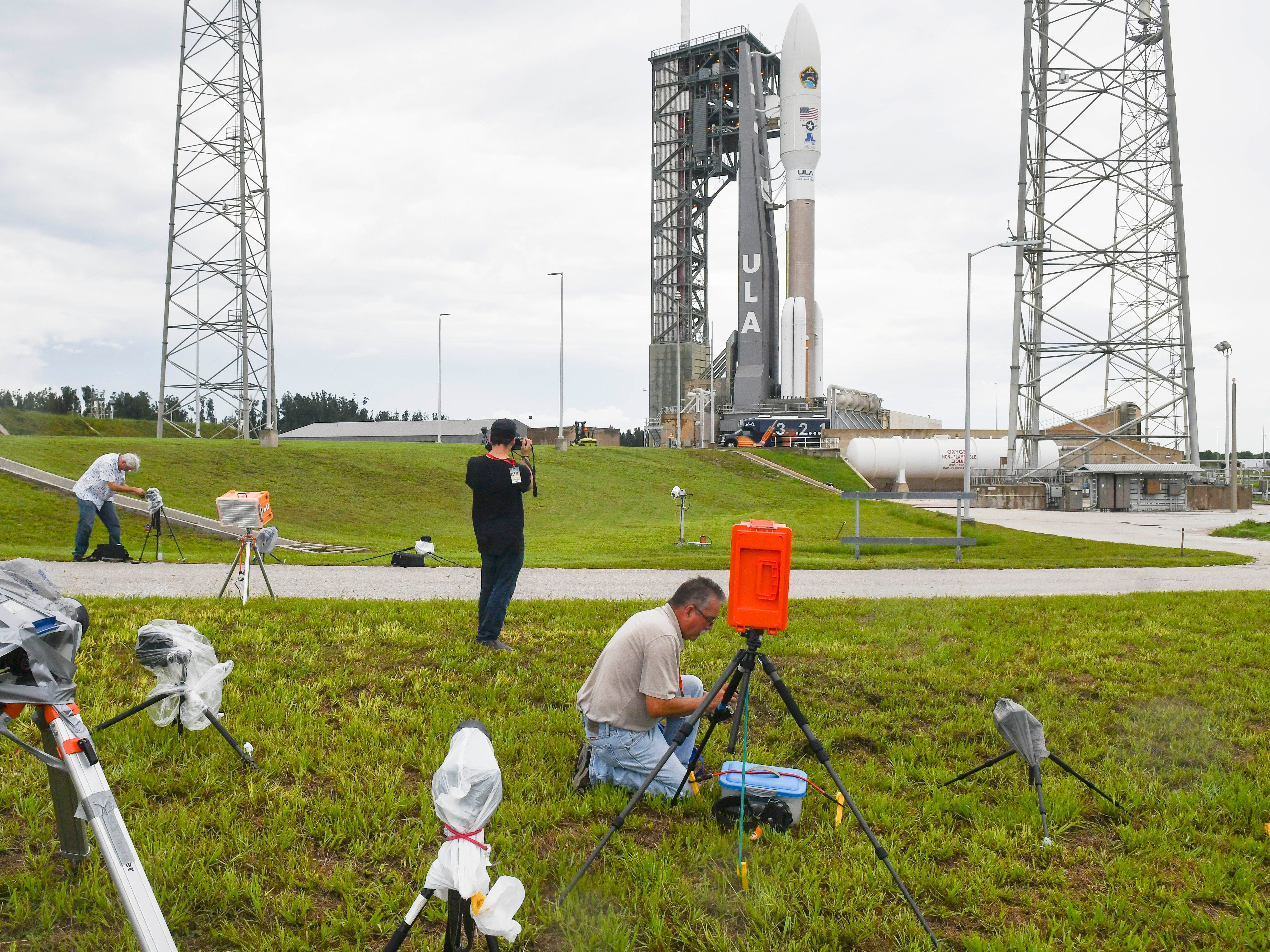 Photographers set up remote cameras in advance of tonight's launch of a United Launch Alliance Atlas V rocket from Cape Canaveral Air Force Station. The rocket is carrying the AEHF 5 communications satellite for the U.S. military.