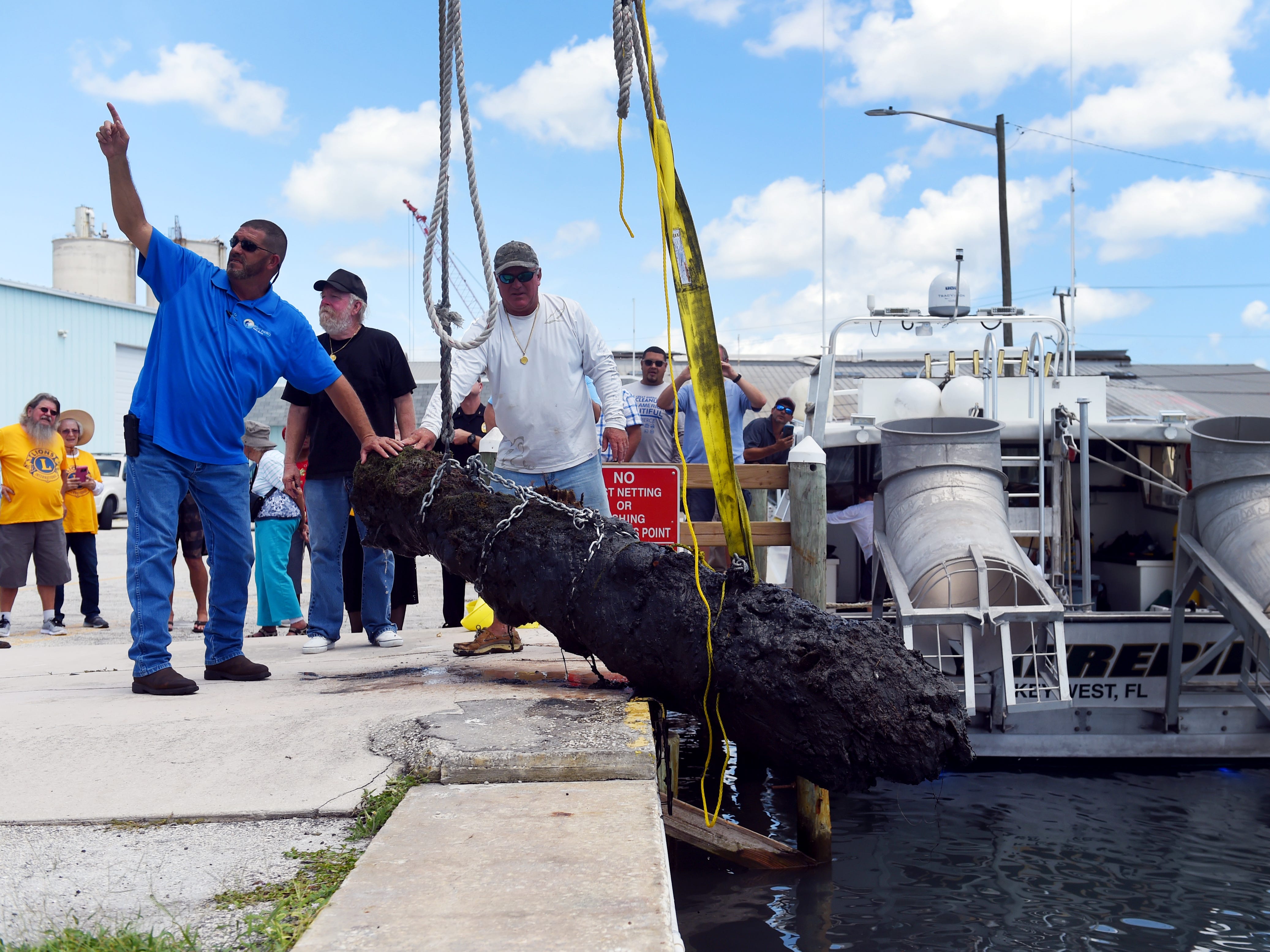 A work crew from the City of Fort Pierce along with members of Maritime Research and Recovery hoist a cannon from the 1715 Spanish Plate Fleet out of the water at Fisherman's Wharf on Monday, Aug. 13, 2018 in Fort Pierce. The recovery of the cannon, discovered in the remains of a shipwreck off Sandy Point, is a collaboration between the Keep Fort Pierce Beautiful Advisory Board and the Fort Pierce Lions Club. The restoration of the cannon will take about three years and will be put on display in the plaza at Melody Lane Fishing Pier.