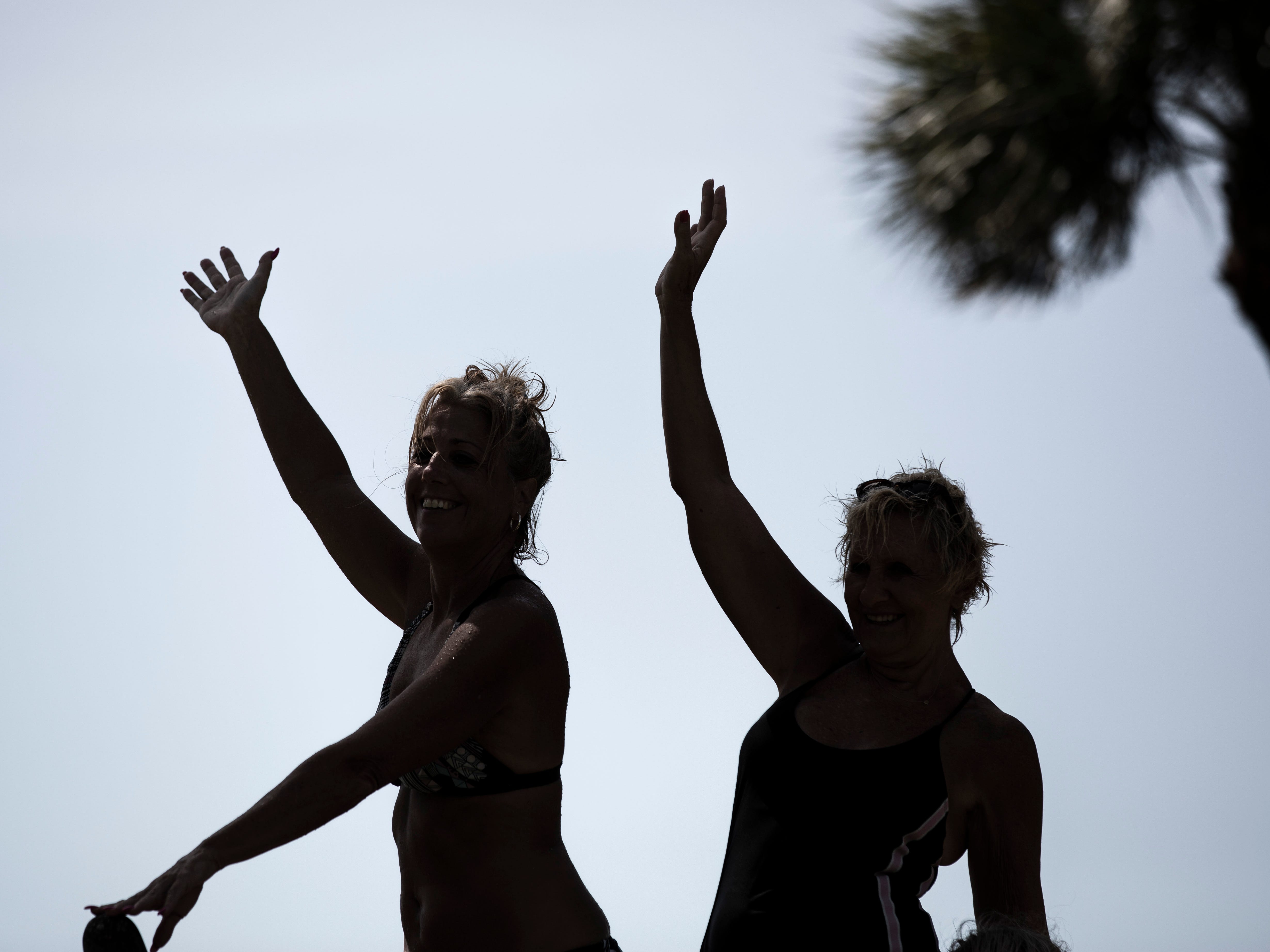 Linda Crea, left, and Chris Kozlowski, right, pose for a photo at the Naples Beach on Tuesday, September 3, 2019. They evacuated from St. Lucie on east coast of Florida last Friday. Locals and tourists continue visiting scenic spots in Naples, taking advantage of heavy winds and waves bought on by Hurricane Dorian.