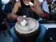 A drummer plays with taped fingers during the community drum circle at Siesta Key Beach on Sunday, January 21, 2018 in Sarasota. 