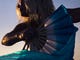 A woman dances with fans during the community drum circle at Siesta Key Beach on Sunday, January 21, 2018 in Sarasota. 