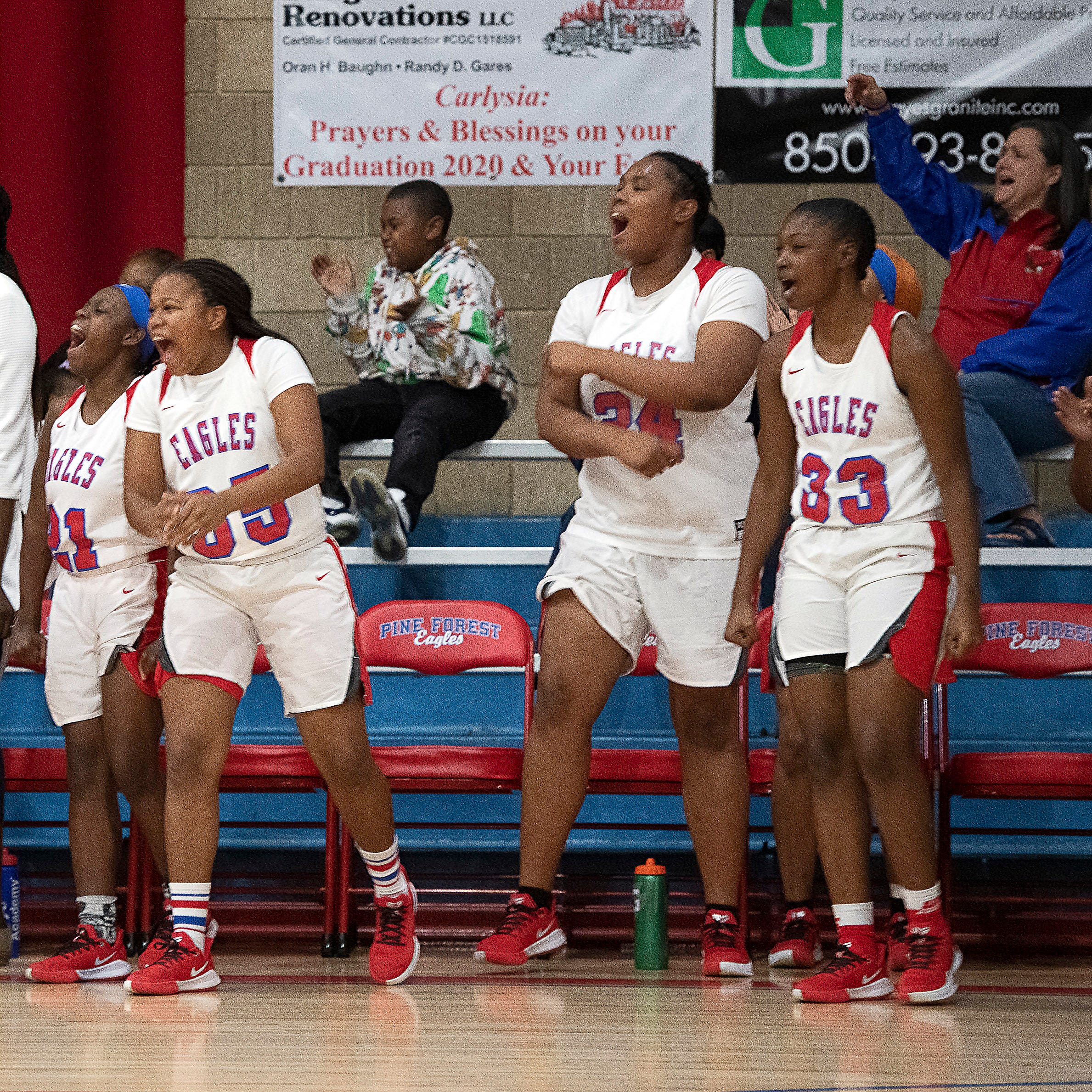 The Pine Forest High School bench celebrates its victory of Choctaw High during the District 1-5A Championship game Friday night. 