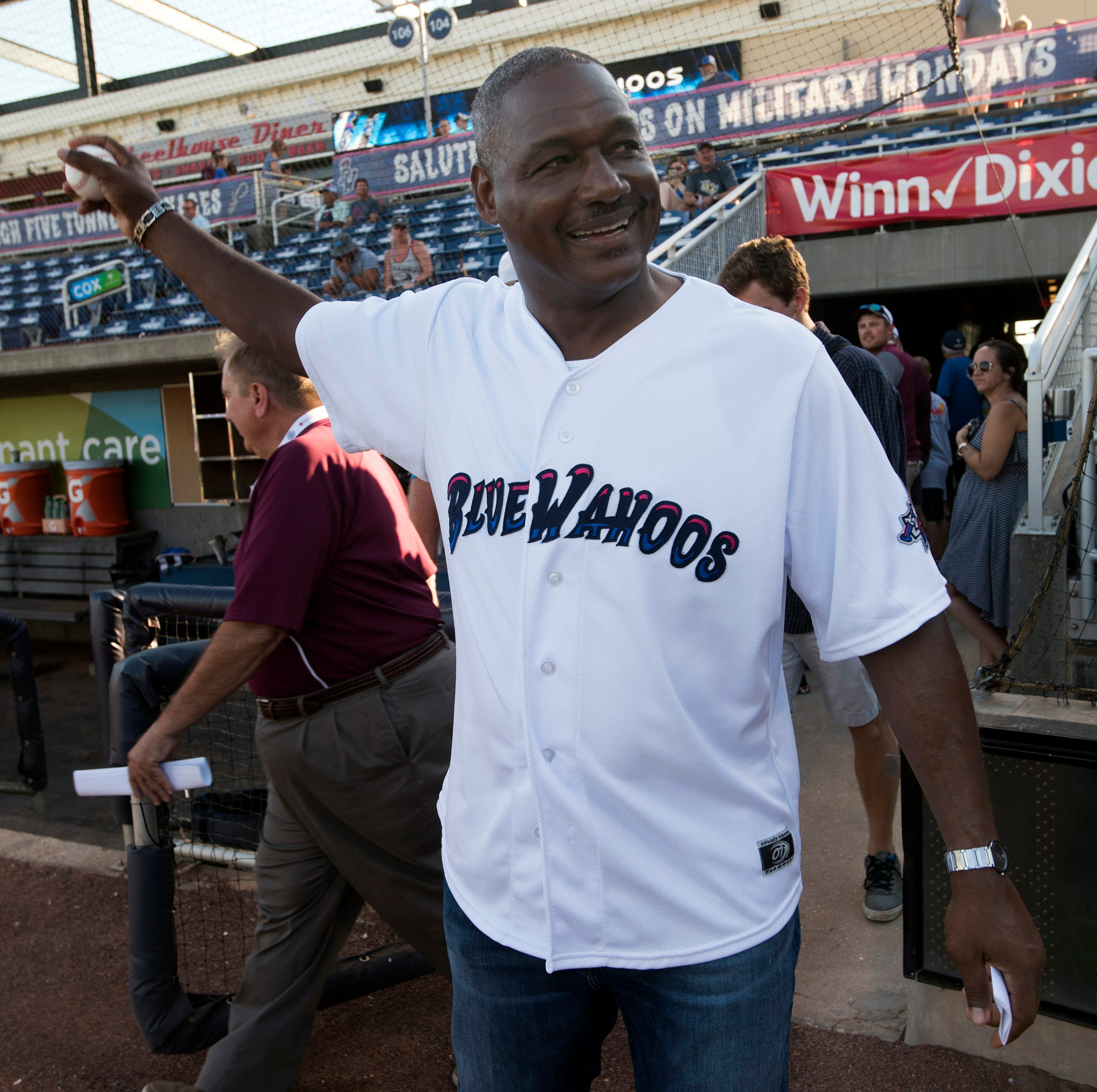 Pensacola native and NFL Hall of Famer Derrick Brooks loosens up his arm before tossing out a ceremonial first pitch to kick off the Blue Wahoos homestand on Thursday, June 13, 2019. 