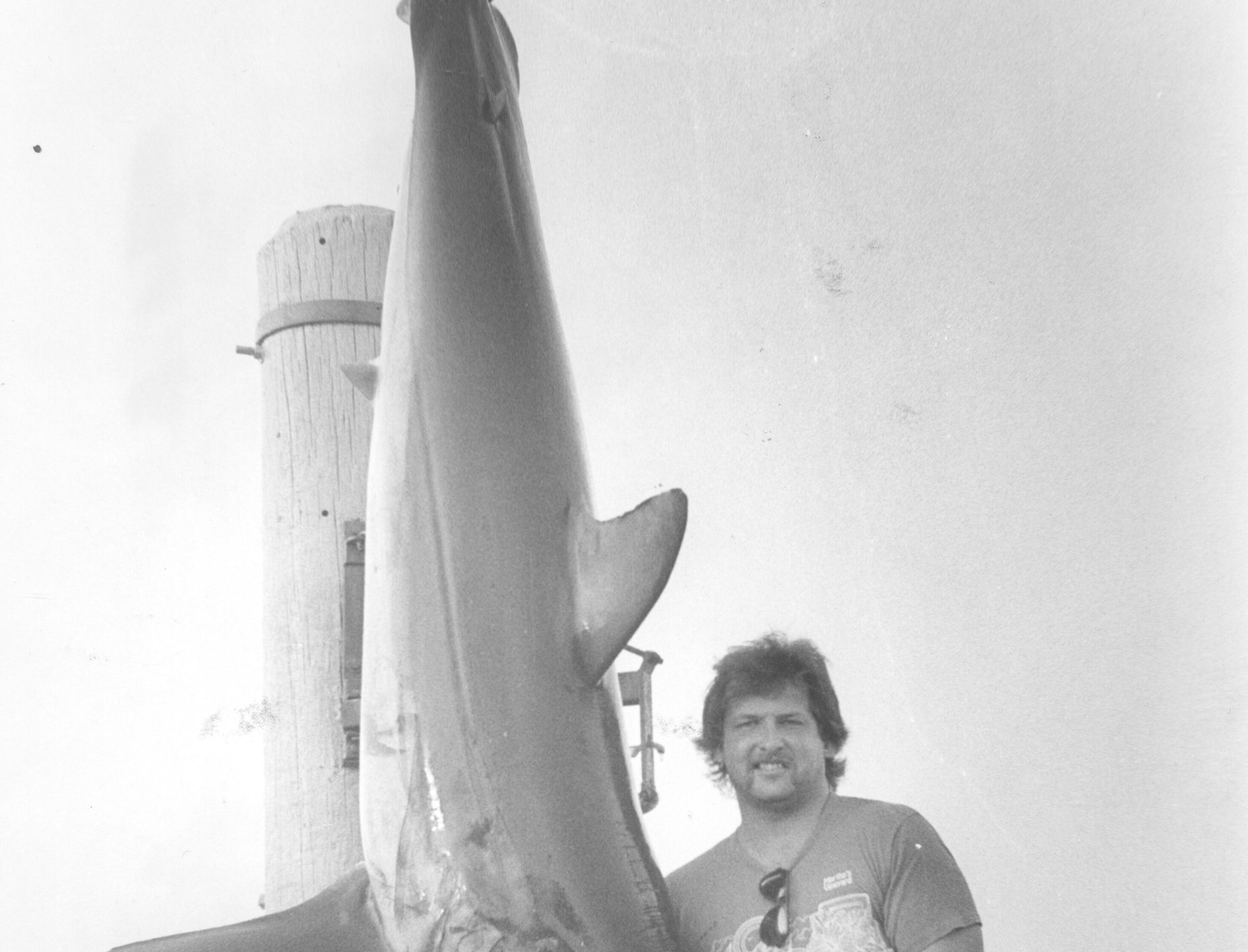 (AUG. 10, 1987) Sayreville's Stan Mozozen proudly displays a 10-foot, 506-pound mako shark he caught recently. Mozozen was on the Betsy III, with Capt. Joe Witt and weighed his fish in at Hoffman's Anchorage in Brielle.