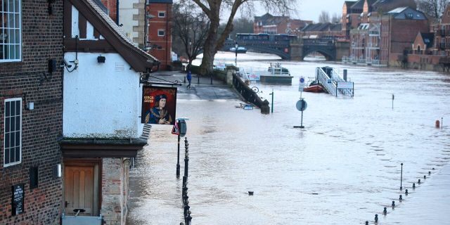 A view of a flooded street after the River Ouse burst its banks in the aftermath of Storm Ciara, in York, England, Monday, Feb. 10, 2020.