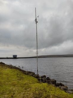The weather station on top of a mast by the water's edge at Yorkshire Dales SC