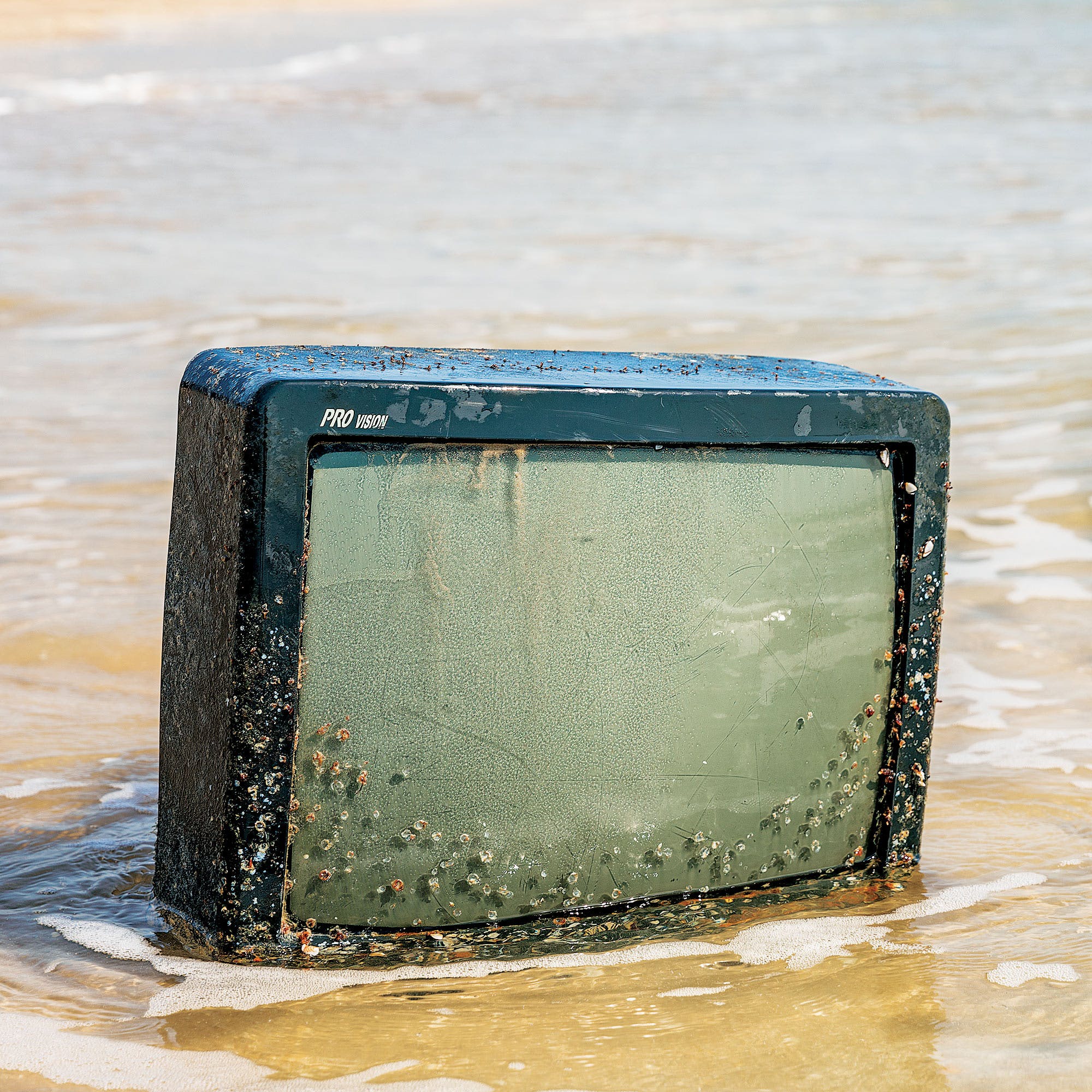 Barnacles cling to a television washed up on the beach around mile marker 27.