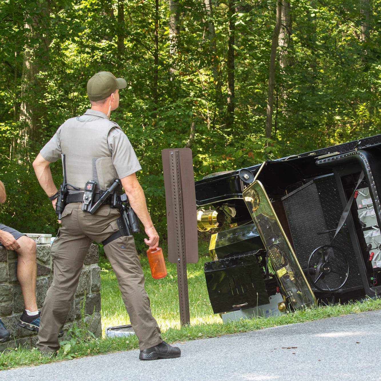 Police investigate at the scene of a single vehicle accident with entrapment involving a GettysPed tour vehicle on West Confederate Avenue, Thursday, July 2, 2020, in the Gettysburg National Military Park in Cumberland Township. According to Jason Martz, acting public affairs officer for Gettysburg National Military Park, two people were flown from the scene with life threatening injuries, and three were taken to the hospital by ground ambulance.