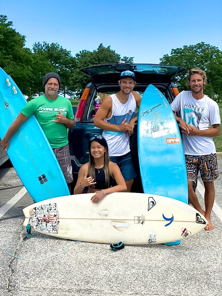 Pictured in middle: Chris Kish and Cat Carrillo, with another local surfers.