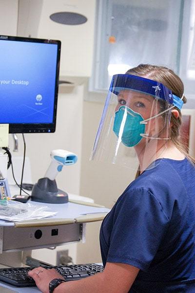 woman working in a hospital in a story about a nurse who got COVID in Birmingham