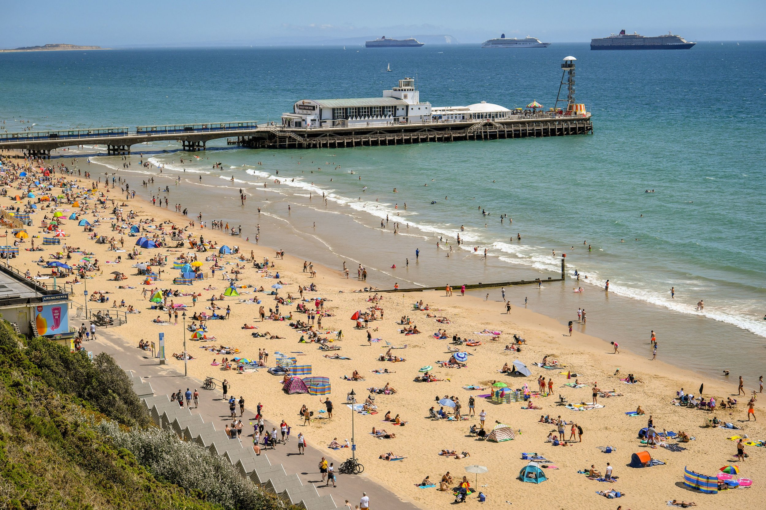 People enjoy the hot weather on the beach at Bournemouth. PA Photo. Picture date: Saturday August 1, 2020. Photo credit should read: Ben Birchall/PA Wire