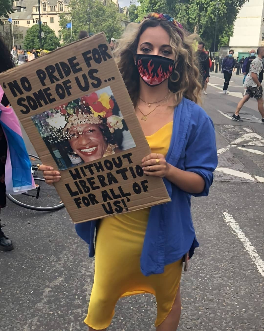 Jade holds up a placard during the London protest in June