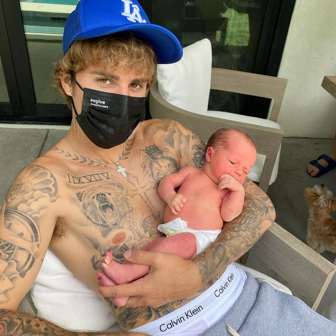 Justin Bieber cradles his niece, Iris, who is the daughter of his wife's sister