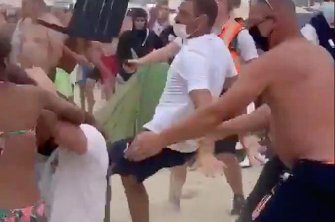 Massive brawl sees beachgoers batter each other with umbrellas and sunbeds in Belgium – The Sun
