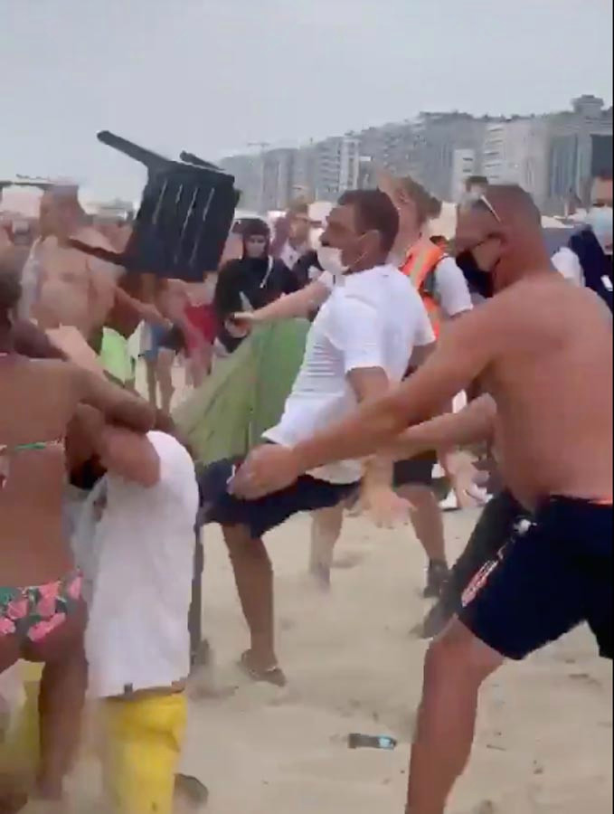 Massive brawl sees beachgoers batter each other with umbrellas and sunbeds in Belgium – The Sun