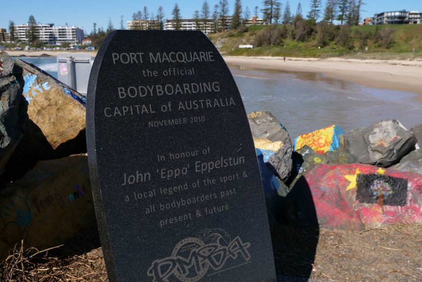 A plaque in the shape of a bodyboard saying "Port Macquarie-Bodyboard Capital of Australia:.