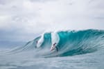 Participants surf Banzai Pipeline at the Volcom Pipe Pro on 4 February, 2018, on the island of Oahu, Hawaii, USA.