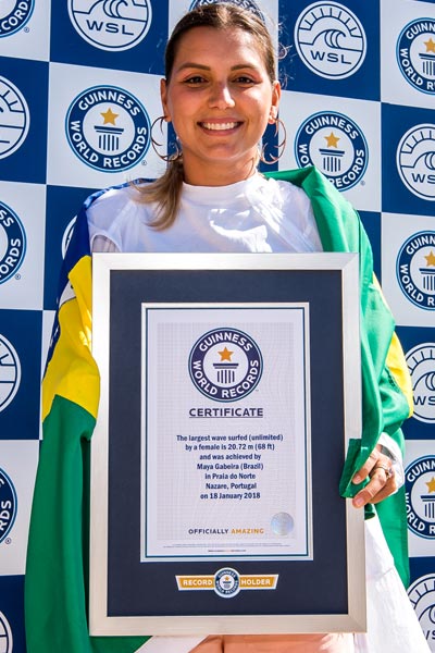 Maya with her certificate for her previous record set in 2018