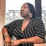 a person sitting in front of a window: Women of the Century: Tarana Burke founded Me Too to protect the most marginalized among us