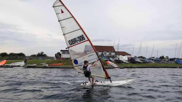 A young windsurfer on the water at North Lincs & Humberside Sailing Club